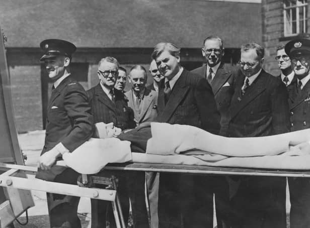 Minister of Health Aneurin Bevan watches a demonstration of a new stretcher on the first day of the new National Health Service in 1948 (Picture: Keystone/Hulton Archive/Getty Images)