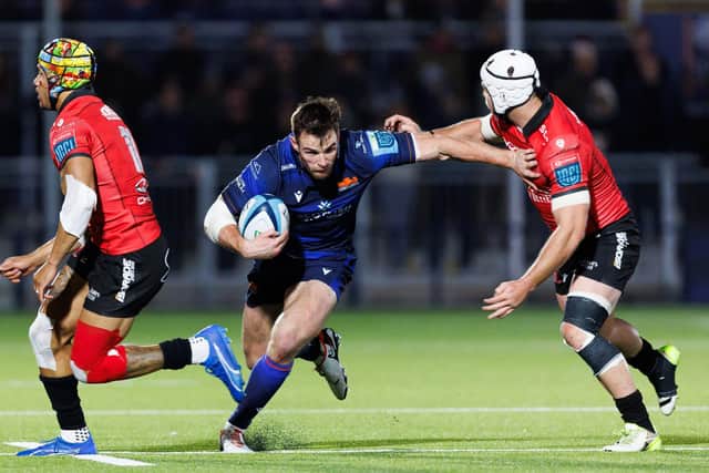 Matt Currie (centre) in action for Edinburgh during the win over the Emirates Lions in the BKT URC at Hive Stadium. (Photo by Ross Parker / SNS Group)