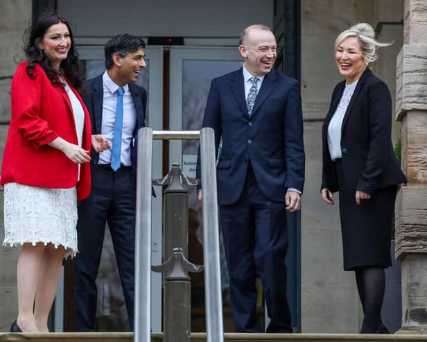 (From left to right) Newly appointed Northern Ireland's deputy first minster, Democratic Unionist Party's Emma Little Pengelly, Prime Minister Rishi Sunak , Britain's Northern Ireland Secretary Chris Heaton-Harris and newly appointed Northern Ireland's First Minster, Sinn Fein's Michelle O'Neill speak together as they leave Stormont Castle. Picture: Paul Faith/AFP via Getty Images