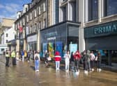 People queue outside the flagship Scottish Primark store on Princes Street in Edinburgh after it reopened following the initial spring 2020 lockdown. Picture: Jane Barlow/PA Wire