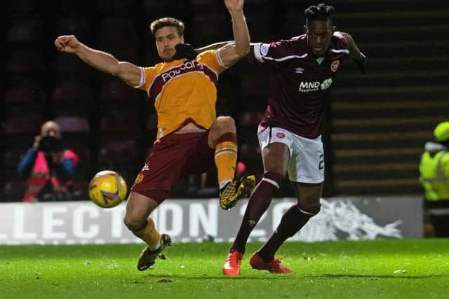 Heart's Armand Gnanduillet pushes Motherwell's Solholm Johansen.  (Photo by Craig Foy / SNS Group)