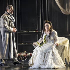 Hye-Youn Lee as Violetta Valéry and Phillip Rhodes as Giorgio Germont in Scottish Opera's production of La traviata. PIC: James Glossop