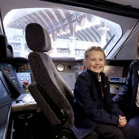 LNER driver Becky Brown and her daughter Maisie in a train cab. PIcture: Nigel Roddis/PA Wire
