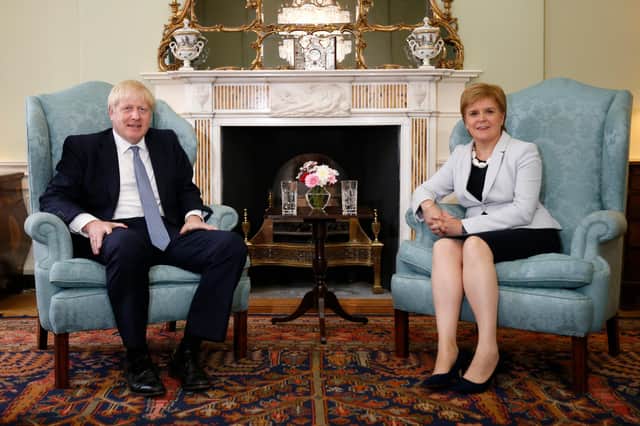 Scotland's First Minister Nicola Sturgeon with Prime Minister Boris Johnson in Bute House in Edinburgh.