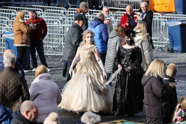 Two Scotland fans attend BT Murrayfield in fancy dress.