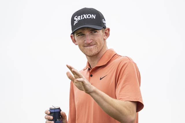 Nairn amateur Calum Scott acknowledges the fans during the third round of the 152nd Open at Royal Troon. Picture: Tom Russo/The Scotsman
