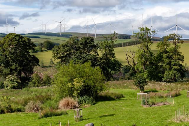 This montage shows how the proposed Greystone Knowe scheme, which will have 14 turbines standing up to 180m tall, would look when viewed from Crookston. Picture: Dougie Johnston