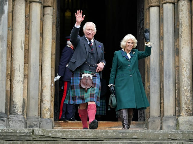King Charles III and the Queen Consort wave as they leave Dunfermline Abbey, after a visit to mark its 950th anniversary, and after attending a meeting at the City Chambers in Dunfermline, Fife, where the King formally marked the conferral of city status on the former town.