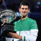 Reigning champion Djokovic lifted the 2021 Australian Open trophy on February 21, 2021. (Photo by TPN/Getty Images)