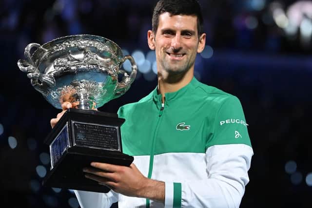 Reigning champion Djokovic lifted the 2021 Australian Open trophy on February 21, 2021. (Photo by TPN/Getty Images)