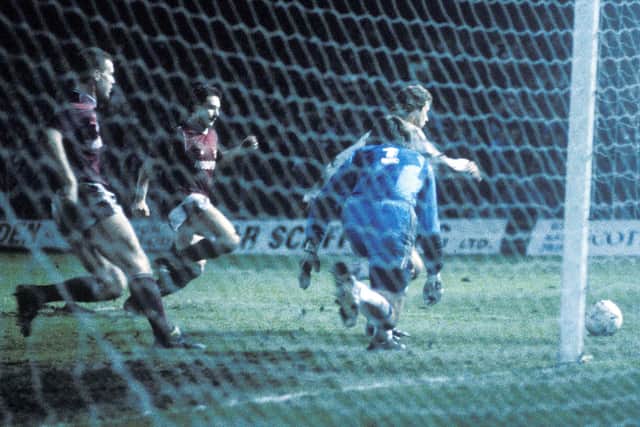 John Colquhoun (right) and Mike Galloway bear down on Bayern Munich goalkeeper Raimond Aumann on a famous night at Tynecastle in 1989