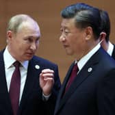 Russian president Vladimir Putin speaks to China's president Xi Jinping during the Shanghai Co-operation Organisation (SCO) leaders' summit in Samarkand last September. Picture: SPUTNIK/AFP via Getty Images