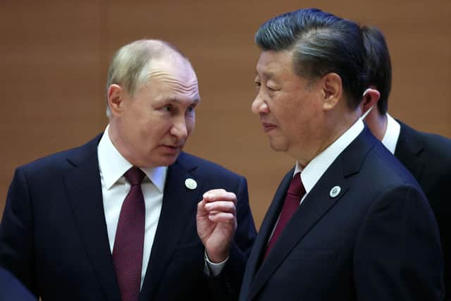 Russian president Vladimir Putin speaks to China's president Xi Jinping during the Shanghai Co-operation Organisation (SCO) leaders' summit in Samarkand last September. Picture: SPUTNIK/AFP via Getty Images