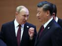 Russian president Vladimir Putin speaks to China's president Xi Jinping during the Shanghai Co-operation Organisation (SCO) leaders' summit in Samarkand last September. Picture: SPUTNIK/AFP via Getty Images