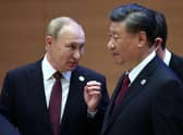 Russian president Vladimir Putin speaks to China's president Xi Jinping during the Shanghai Co-operation Organisation (SCO) leaders' summit in Samarkand last September. Picture: SPUTNIK/AFP via Getty Images