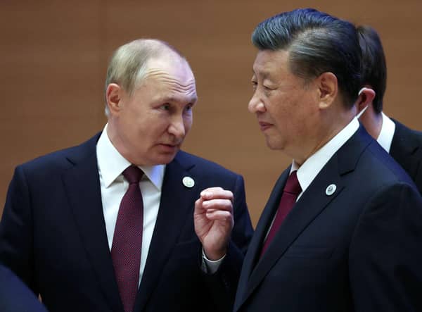 Russian president Vladimir Putin speaks to China's president Xi Jinping during the Shanghai Co-operation Organisation (SCO) leaders' summit in Samarkand last September. Picture: SPUTNIK/AFP via Getty Images
