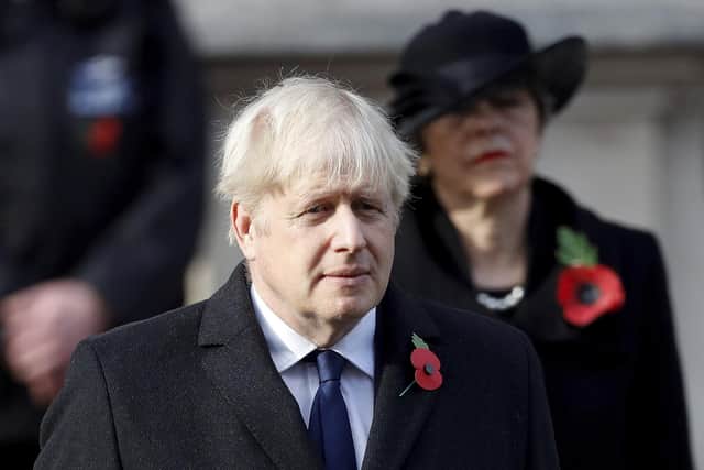Britain's Boris Johnson attends the Remembrance Sunday service. Picture: Peter Nicholls/Pool Photo via AP