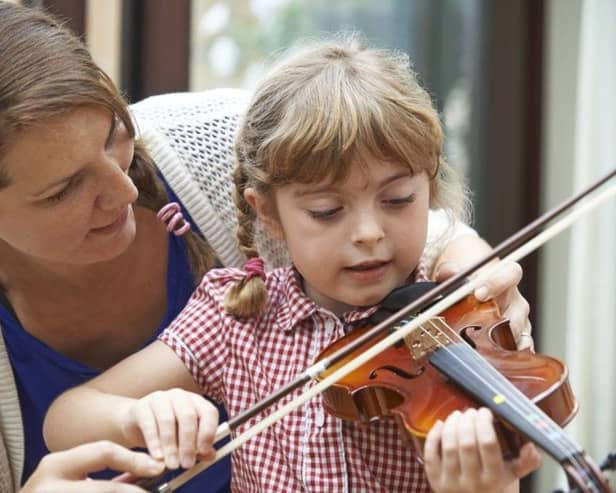 Government funding for music tuition has been hailed a success - but cash should be ring fenced, a new report says 