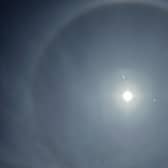 Photo of a halo around the moon above houses in Staffordshire (Pic: Ben Light/PA Wire)