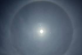 Photo of a halo around the moon above houses in Staffordshire (Pic: Ben Light/PA Wire)