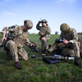 Soldiers from 16 Air Assault Brigade set up and fly military drones after jumping from a transport aircraft onto Salisbury Plain at Copehill Down training facility earlier this year (Picture: Finnbarr Webster/Getty Images)