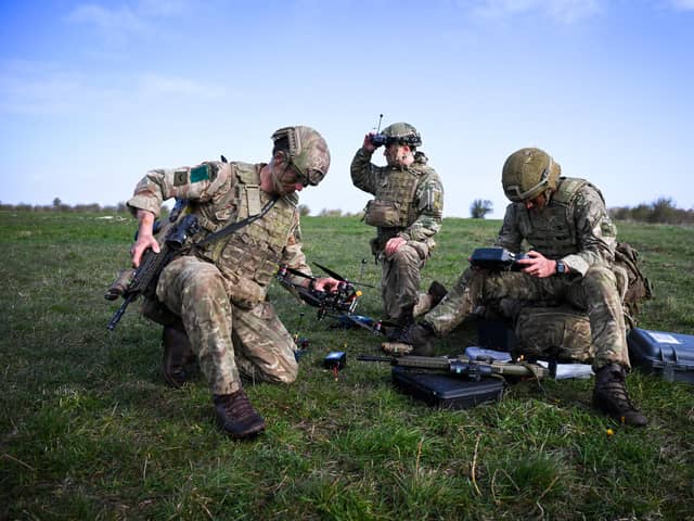 Soldiers from 16 Air Assault Brigade set up and fly military drones after jumping from a transport aircraft onto Salisbury Plain at Copehill Down training facility earlier this year (Picture: Finnbarr Webster/Getty Images)