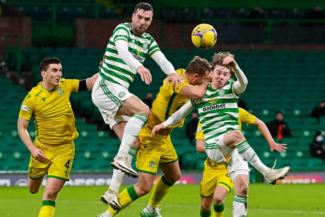 Celtic debutant Cameron Harper (far right) competes with Ryan Porteous in the air at Celtic Park (Photo by Rob Casey / SNS Group)