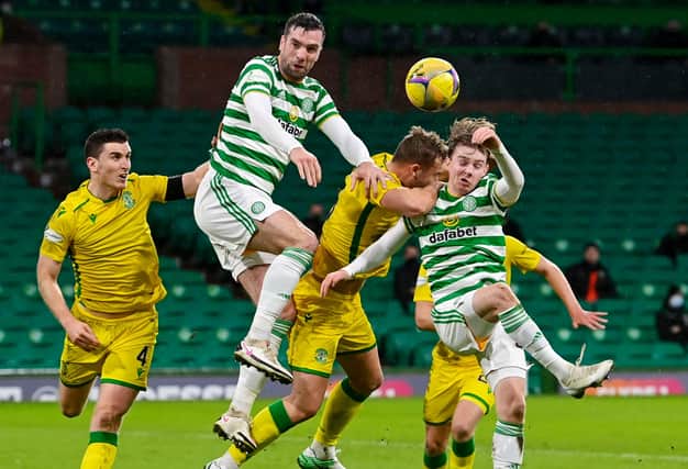 Celtic debutant Cameron Harper  (far right) competes with Ryan Porteous in the air  at Celtic Park (Photo by Rob Casey / SNS Group)