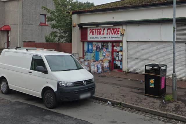 Police investigating the crime said the 22-year-old was working in Peter’s Store in Househillwood Road at 6:45pm on Monday when a man entered the shop and threatened him with a knife.