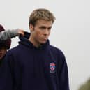 Actor Ed McVey, who plays the part of Prince William, on set in between filming scenes at the harbour for the next season of The Crown in St Andrews