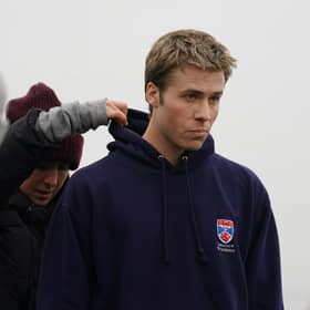 Actor Ed McVey, who plays the part of Prince William, on set in between filming scenes at the harbour for the next season of The Crown in St Andrews