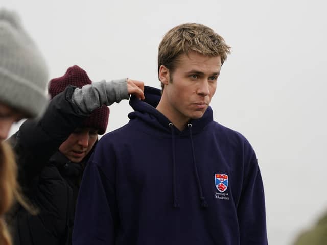 Actor Ed McVey, who plays the part of Prince William, on set in between filming scenes at the harbour for the next season of The Crown in St Andrews