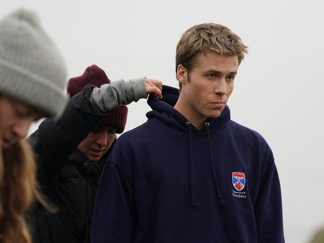 Actor Ed McVey, who plays the part of Prince William, on set in between filming scenes at the harbour for the next season of The Crown in St Andrews