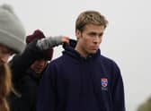 Actor Ed McVey, who plays the part of Prince William, on set in between filming scenes at the harbour for the next season of The Crown in St Andrews