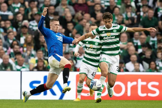 John Lundstram and Matt O'Riley in action during a cinch Premiersip match between Celtic and Rangers at Celtic Park, on September 03, 2022, in Glasgow, Scotland. (Photo by Alan Harvey / SNS Group)