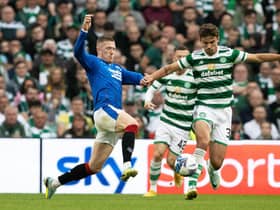 John Lundstram and Matt O'Riley in action during a cinch Premiersip match between Celtic and Rangers at Celtic Park, on September 03, 2022, in Glasgow, Scotland.  (Photo by Alan Harvey / SNS Group)