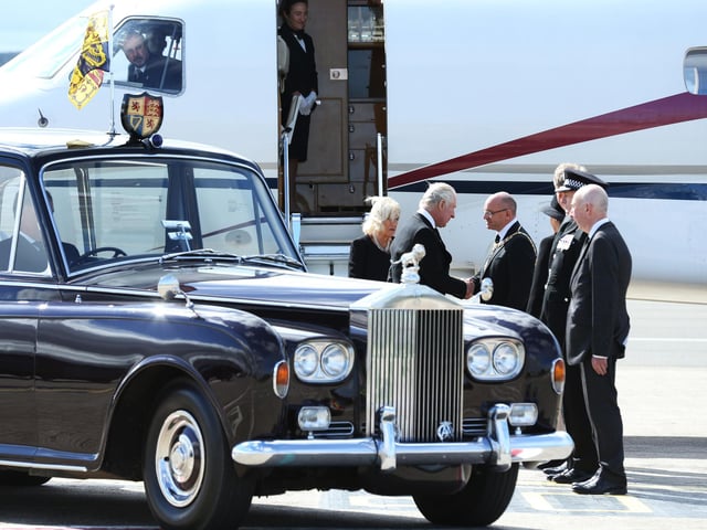 King Charles III and the Queen Consort arrive at Edinburgh Airport after travelling from London, ahead of joining the procession of Queen Elizabeth's coffin from the Palace of Holyroodhouse to St Giles' Cathedral, Edinburgh. Picture date: Monday September 12, 2022.