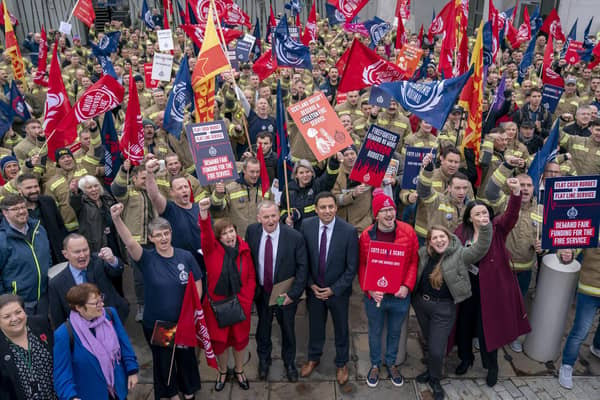 Firefighters from the Fire Brigades' Union and Scottish Labour MSPs protesting outside the Scottish Parliament. Image: Jane Barlow/Press Association.
