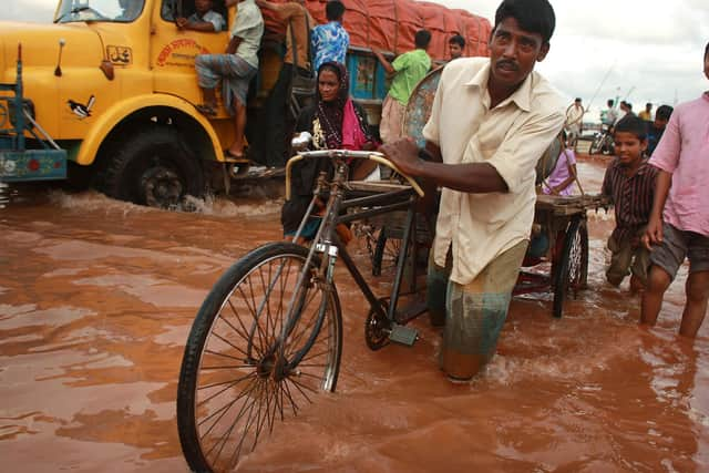 Rising sea levels threaten to submerge large areas of Bangladesh such as the low-lying port city of Chittagong, which already experiences yearly flooding (Picture: Spencer Platt/Getty Images)