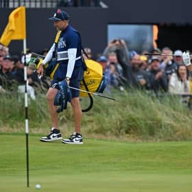 World No 1 Scottie Scheffler reacts after hitting his bunker shot at the last close to make the cut in the 151st Open at Royal Liverpool. Picture: Glyn Kirk/AFP via Getty Images.