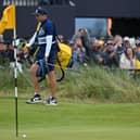 World No 1 Scottie Scheffler reacts after hitting his bunker shot at the last close to make the cut in the 151st Open at Royal Liverpool. Picture: Glyn Kirk/AFP via Getty Images.