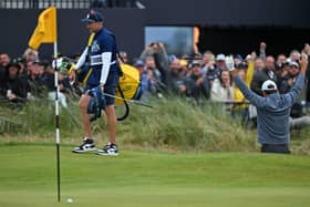 World No 1 Scottie Scheffler reacts after hitting his bunker shot at the last close to make the cut in the 151st Open at Royal Liverpool. Picture: Glyn Kirk/AFP via Getty Images.