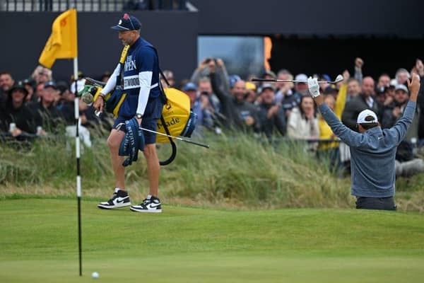 World No 1 Scottie Scheffler reacts after hitting his bunker shot at the last close to make the cut in the 151st Open at Royal Liverpool. Picture: Glyn Kirk/AFP via Getty Images.