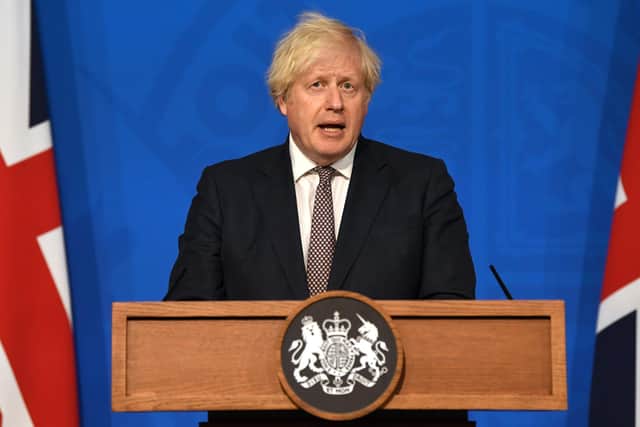 Prime Minister Boris Johnson announces the plan easing of restrictions in England at a Downing Street press conference