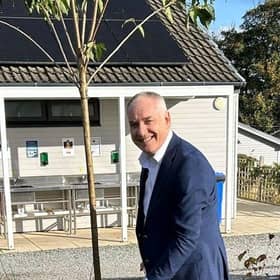 Digging in: Richard Lochhead plants a cherry blossom tree to commemorate the park's top AA award