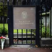 Flowers are laid at the Palace of Holyroodhouse following the death of the Queen