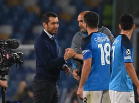 Rangers manager Giovanni van Bronckhorst shakes hands with Napoli striker Giovanni Simeone who struck twice in the 3-0 win. (Photo by ANDREAS SOLARO/AFP via Getty Images)