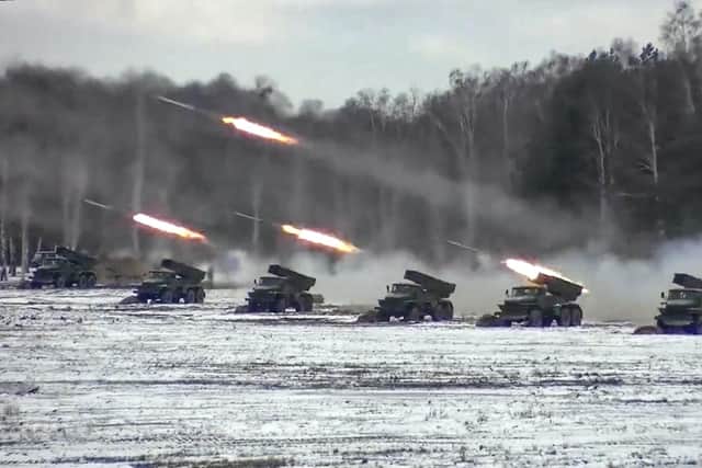 In this photo taken from video and released by the Russian Defense Ministry Press Service on Friday, Feb. 4, 2022, multiple rocket launchers fire during the Belarusian and Russian joint military drills at Brestsky firing range, Belarus. ap