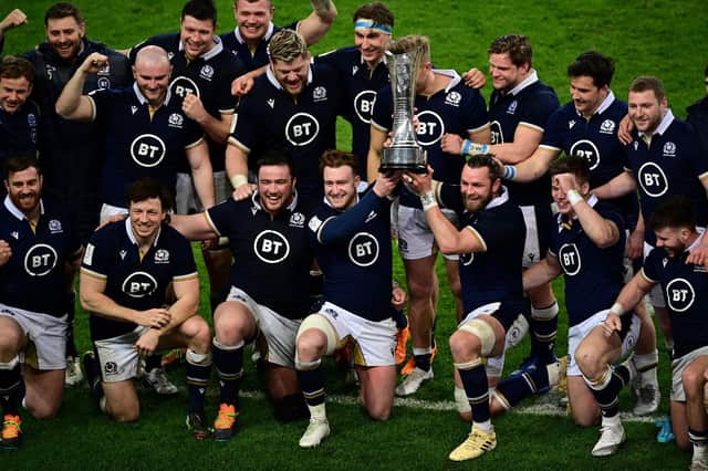 Scotland's players celebrate with the  Auld Alliance Trophy