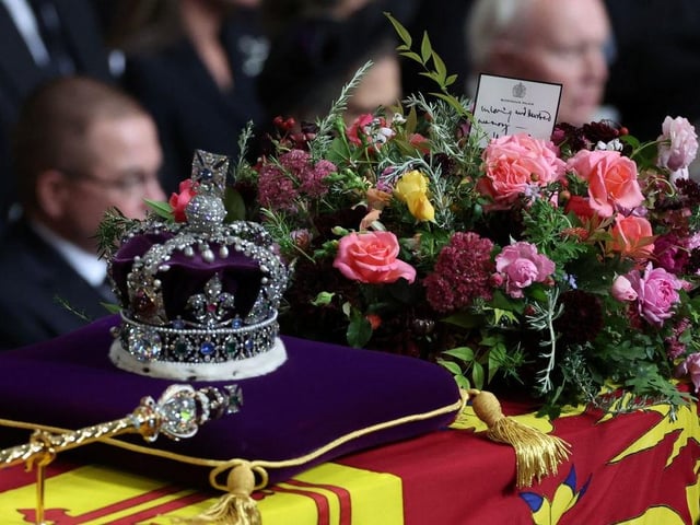 LONDON, ENGLAND - SEPTEMBER 19: The coffin of Queen Elizabeth II is carried into Westminster Abbey during the State Funeral on September 19, 2022 in London, England.  Elizabeth Alexandra Mary Windsor was born in Bruton Street, Mayfair, London on 21 April 1926. She married Prince Philip in 1947 and ascended the throne of the United Kingdom and Commonwealth on 6 February 1952 after the death of her Father, King George VI. Queen Elizabeth II died at Balmoral Castle in Scotland on September 8, 2022, and is succeeded by her eldest son, King Charles III. (Photo by Phil Noble - WPA Pool/Getty Images)